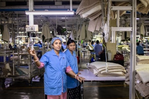 Factory workers oversee production in a modern factory.