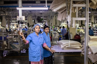 Factory workers oversee production in a modern factory.