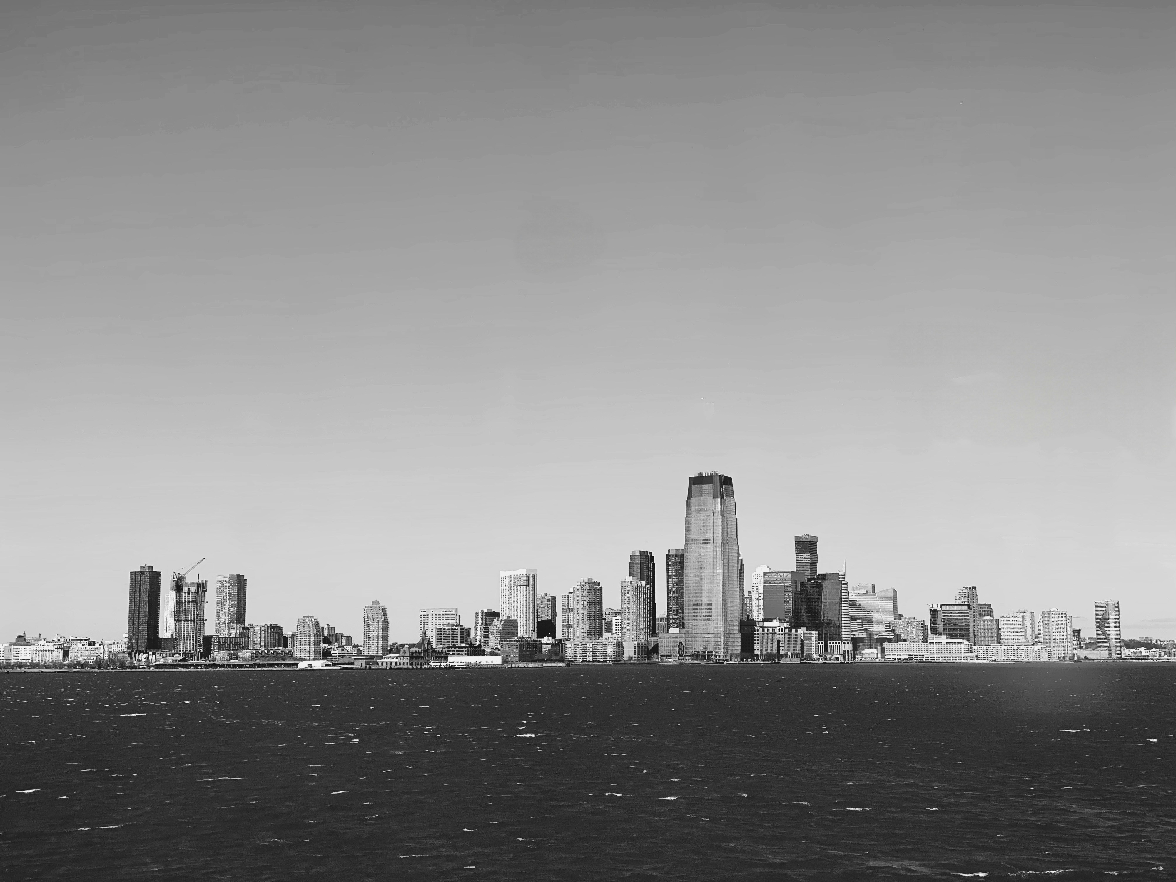 A black and white view of a city skyline.