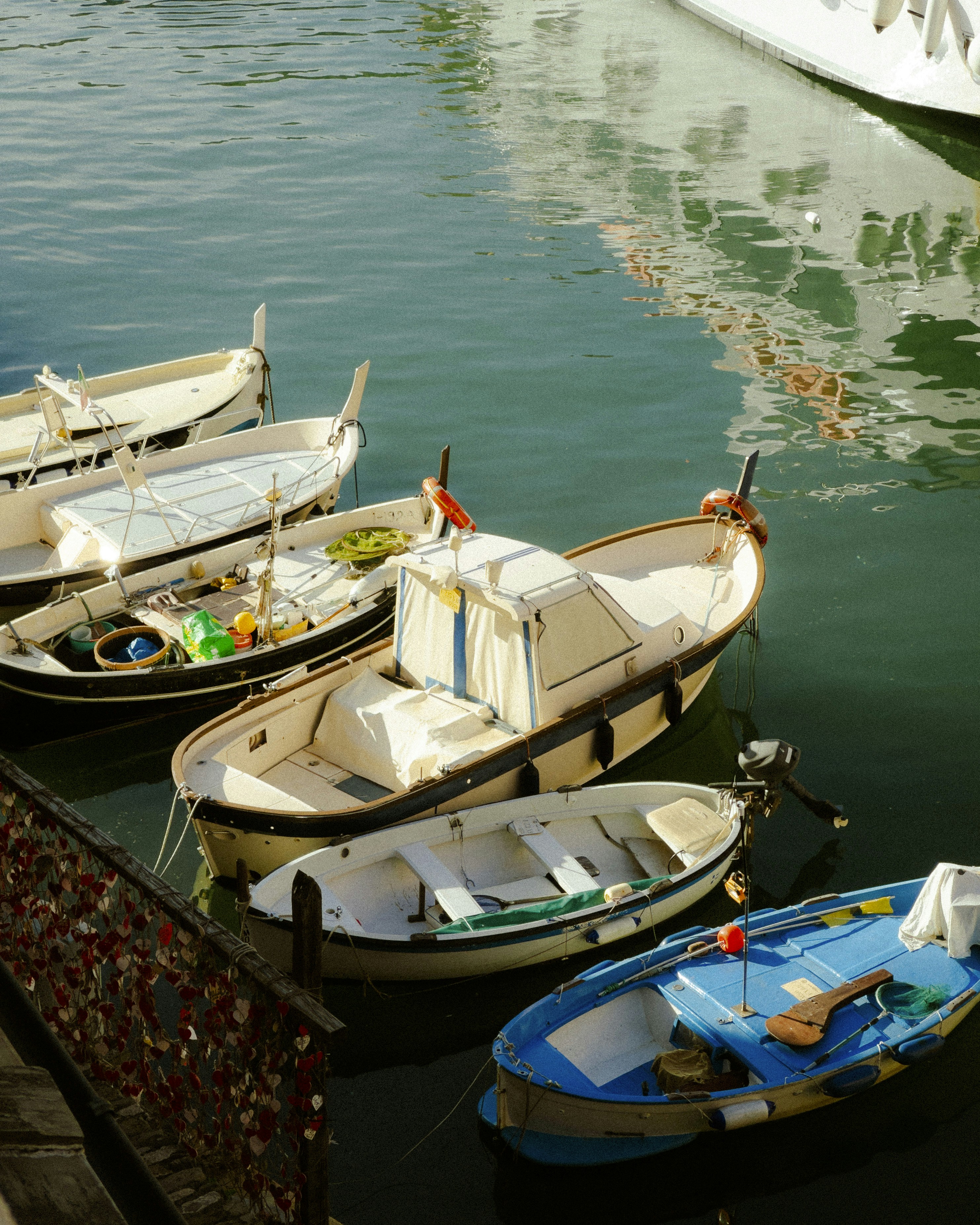 Boats are docked in calm, clear water.