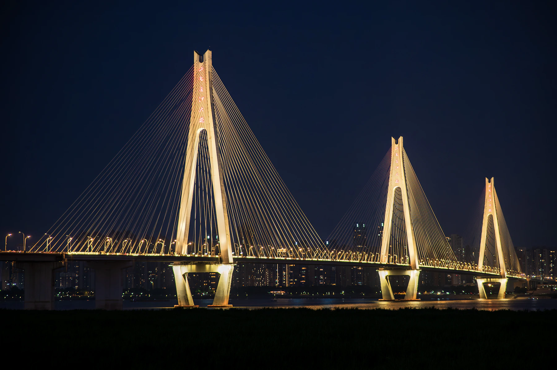 Cable-stayed bridge at night — infrastructure engineering