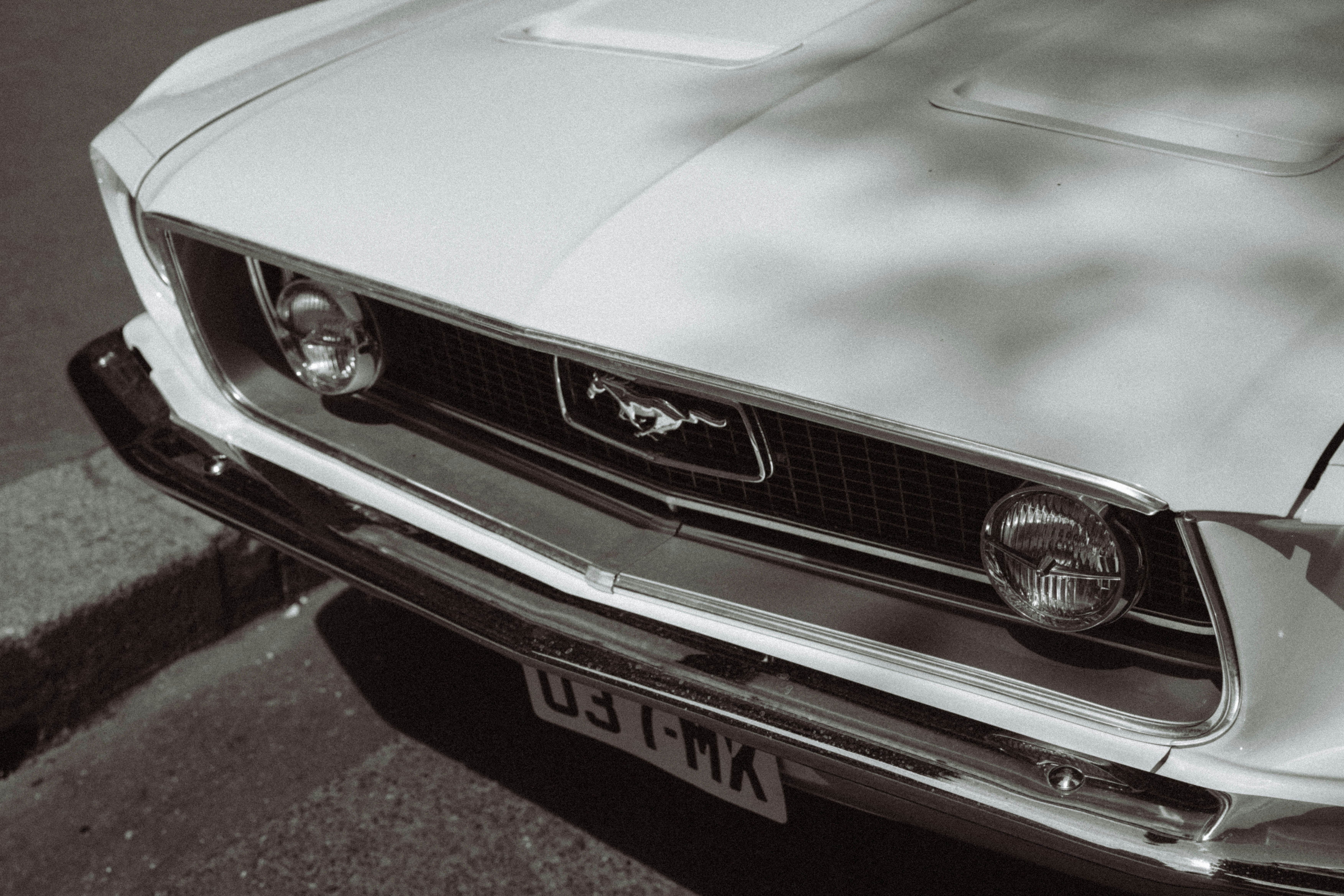 A classic mustang car, black and white.