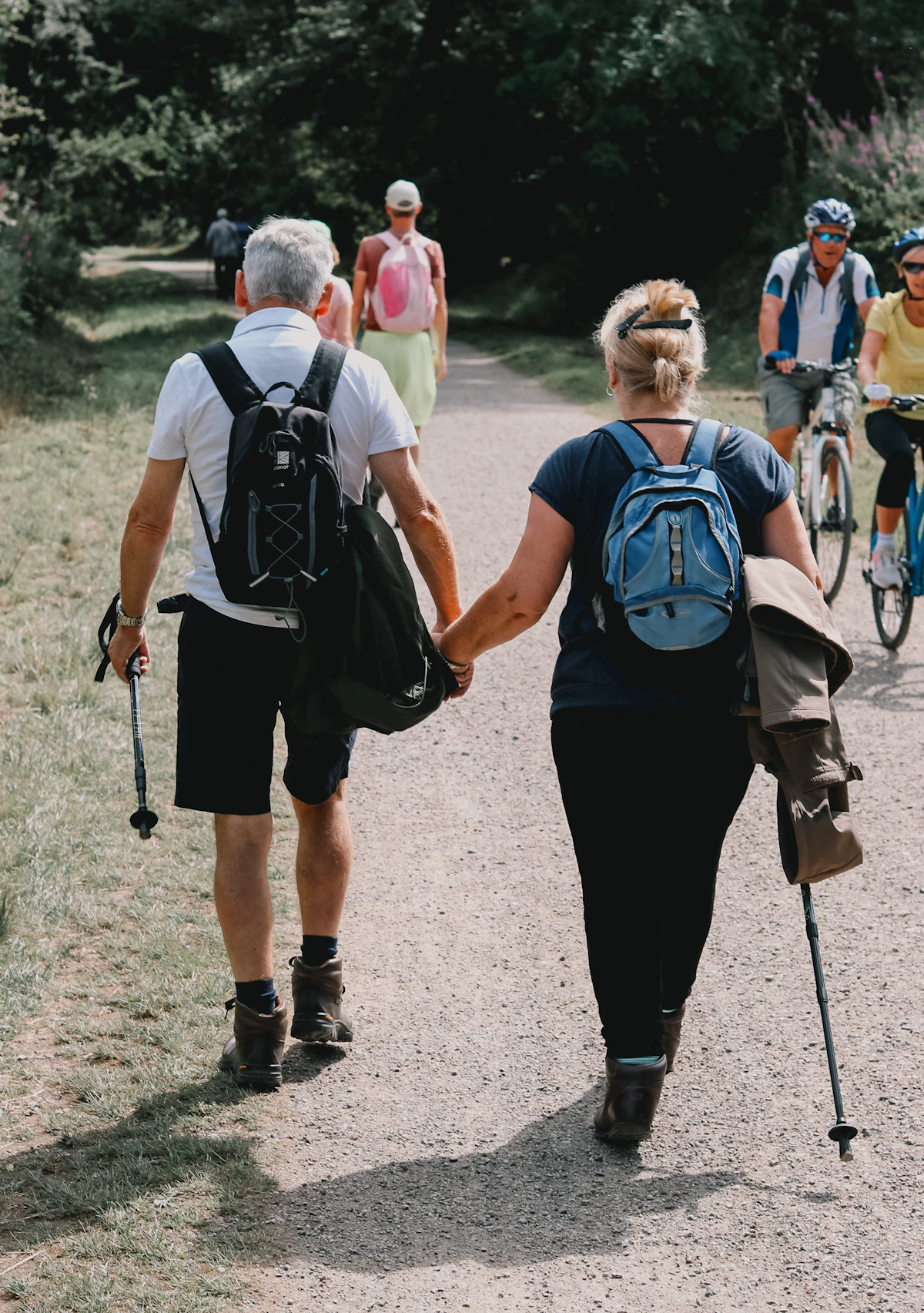 Couple holding hands while walking outdoors