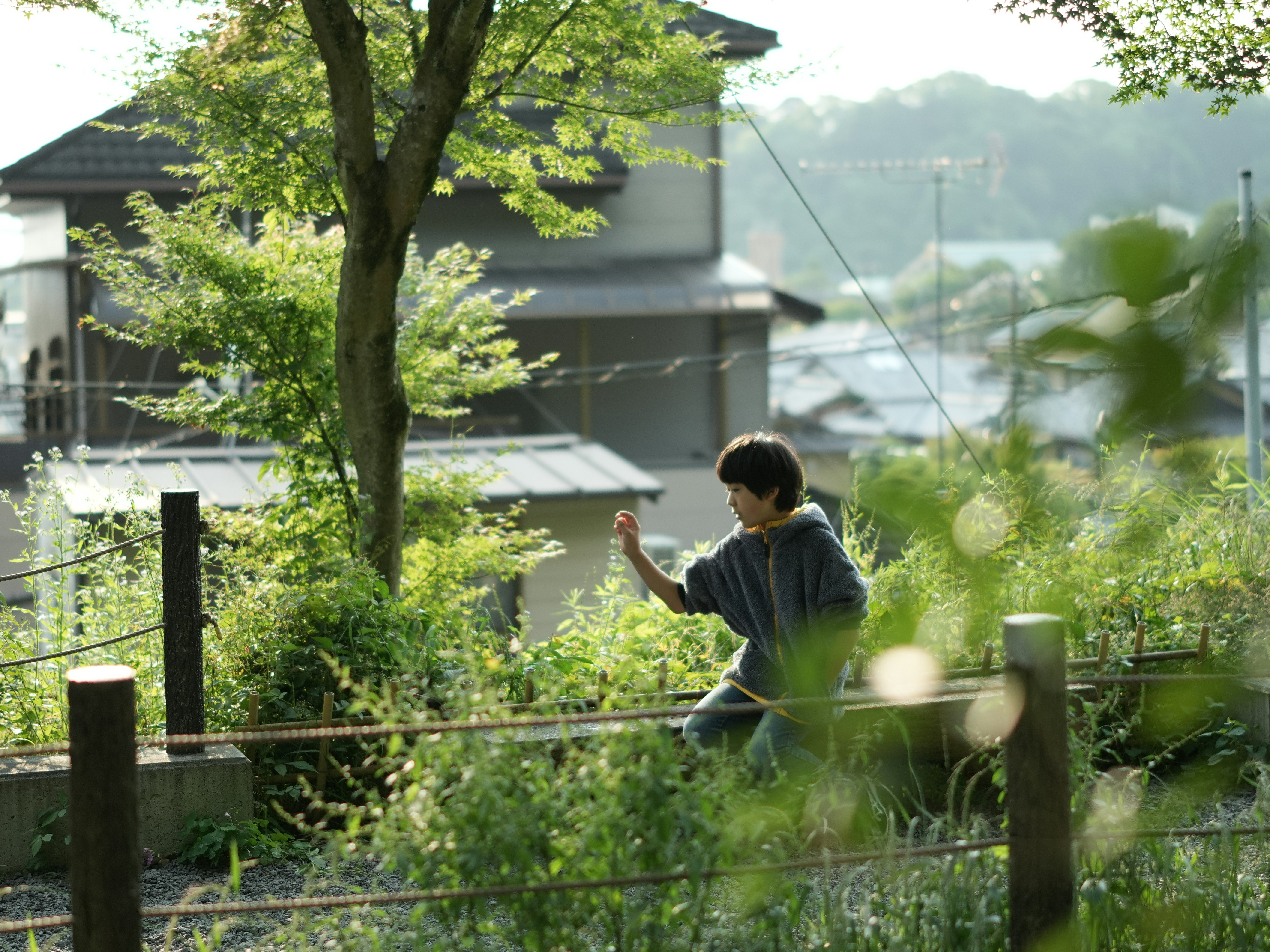 A person practices tai chi outdoors.