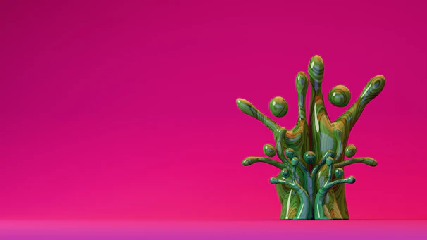 Green paint splash against a pink background.