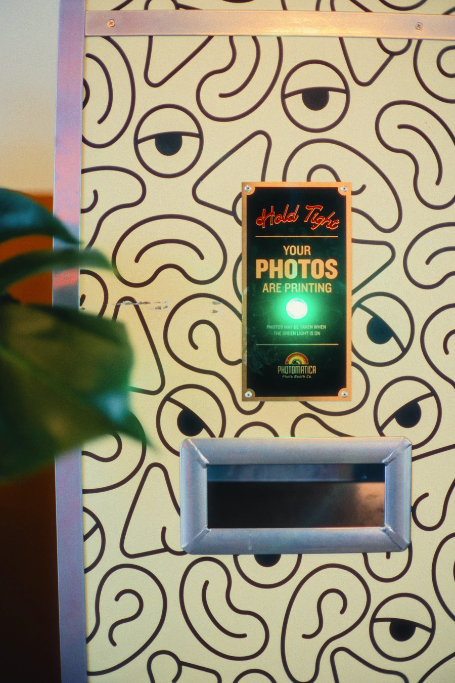 Whimsical event photo booth printing guest photos