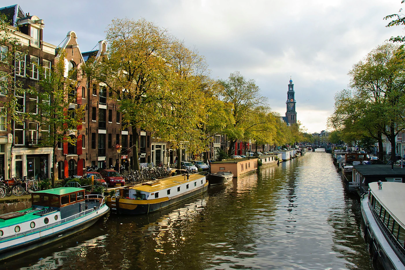 Canal boats and historic waterfront buildings in Amsterdam