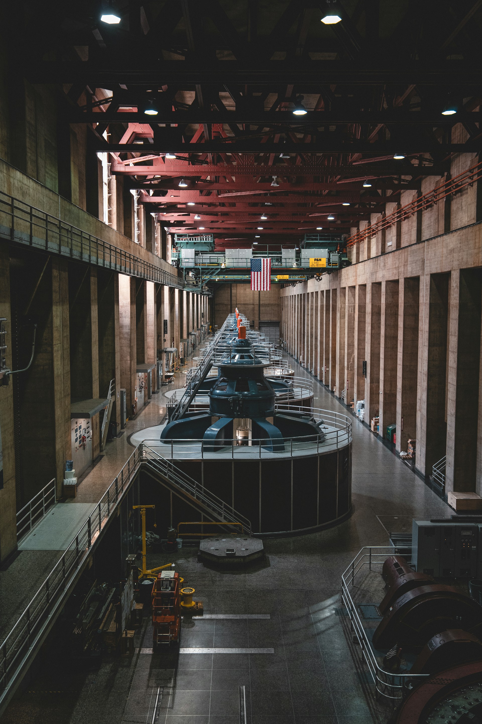 Inside a large hydroelectric power plant building.
