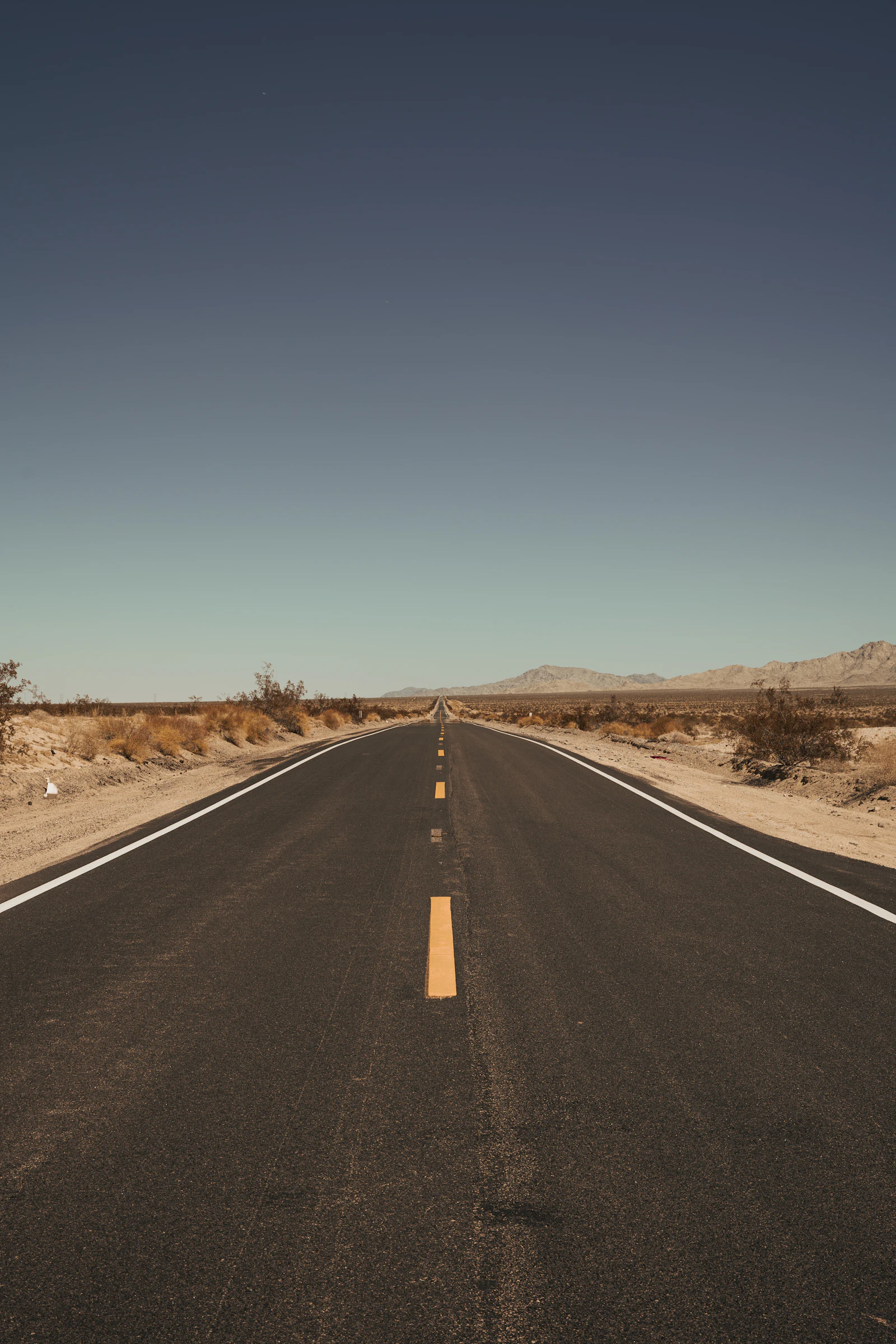 An empty road stretching toward a distant horizon