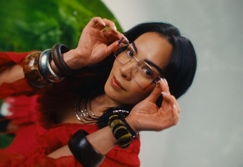 Trendy woman adjusting glasses