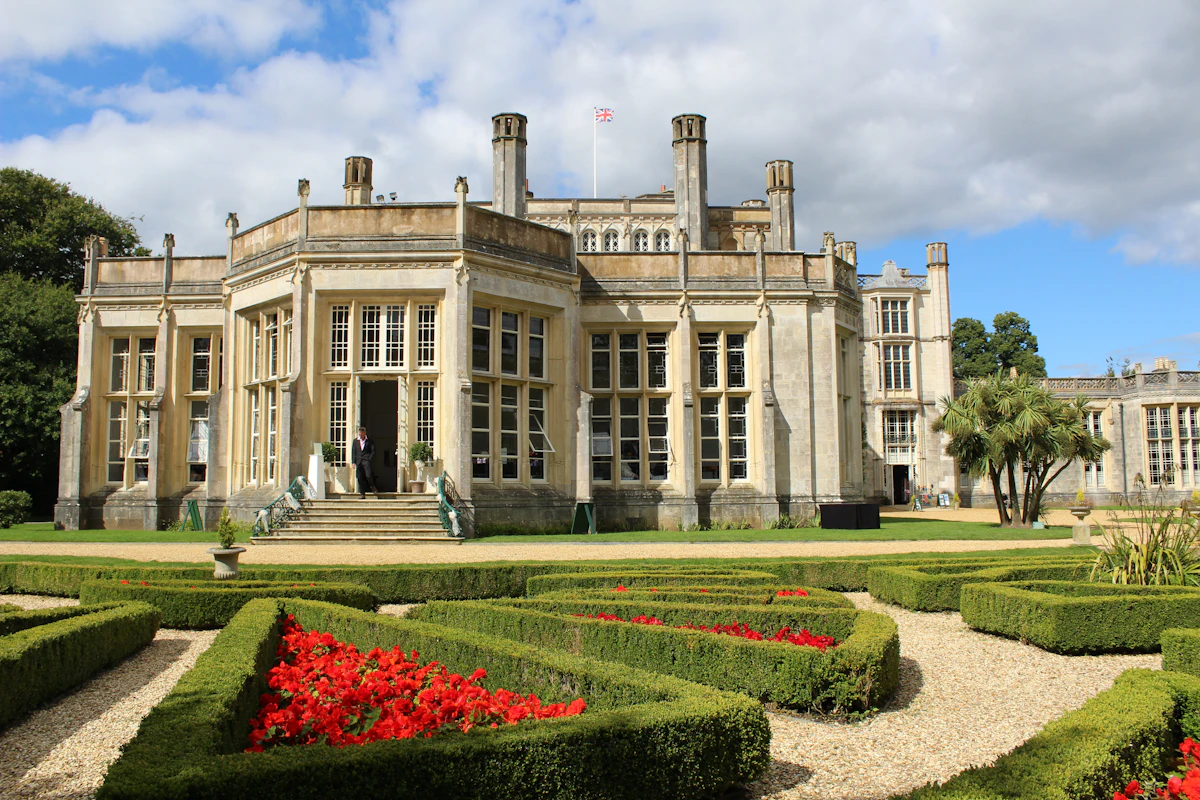 Grand estate manor with formally designed gardens — what coordinated design-build produces versus assembled low bids