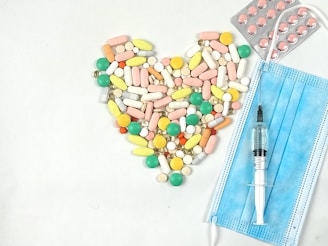 Pills, mask, and syringe symbolize healthcare.