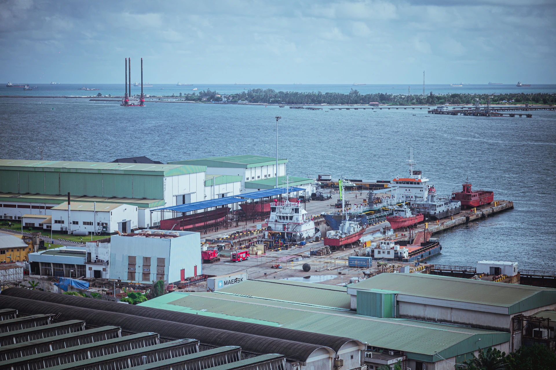 A busy port is filled with several ships.