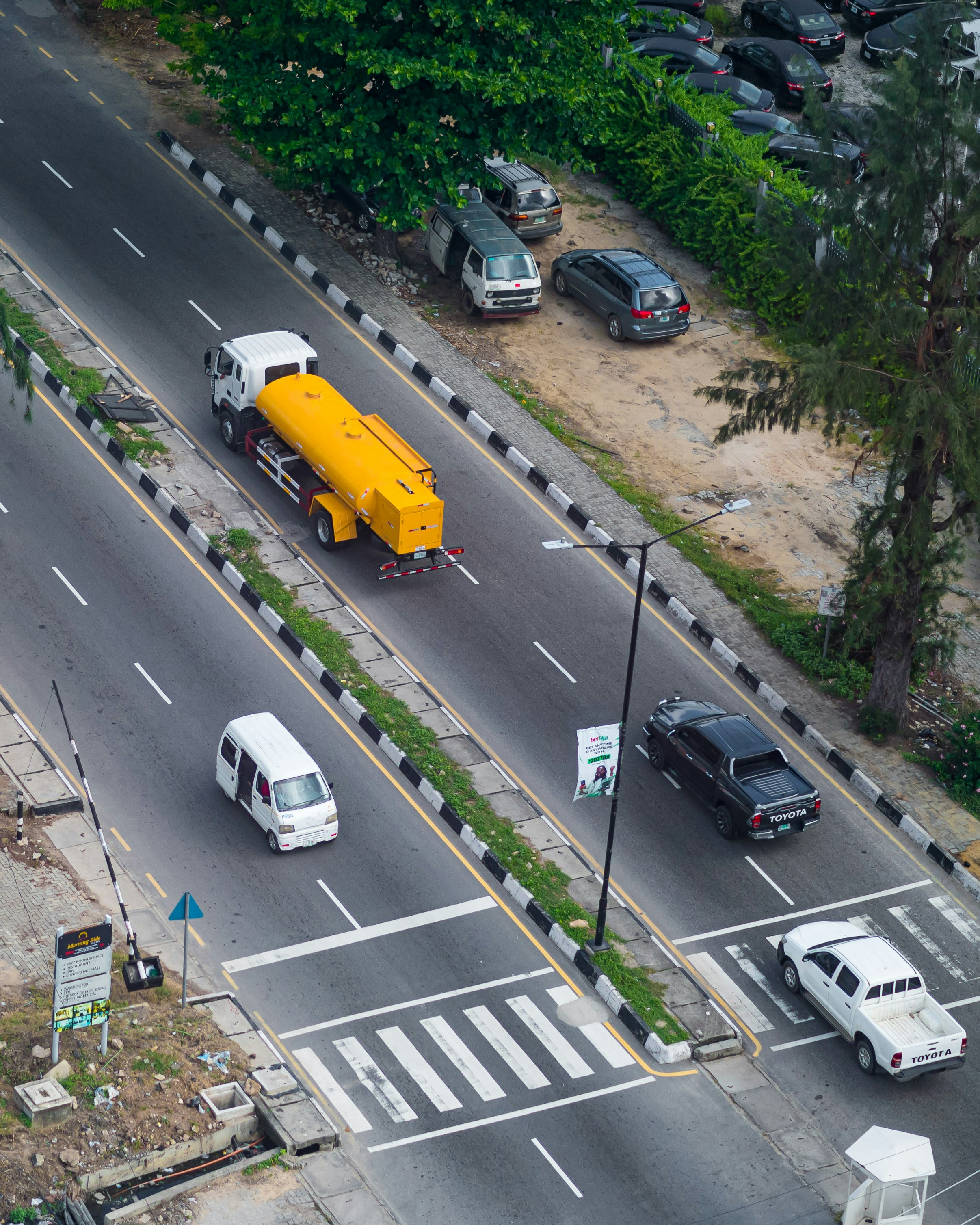 Vehicles travel on a multi-lane highway.