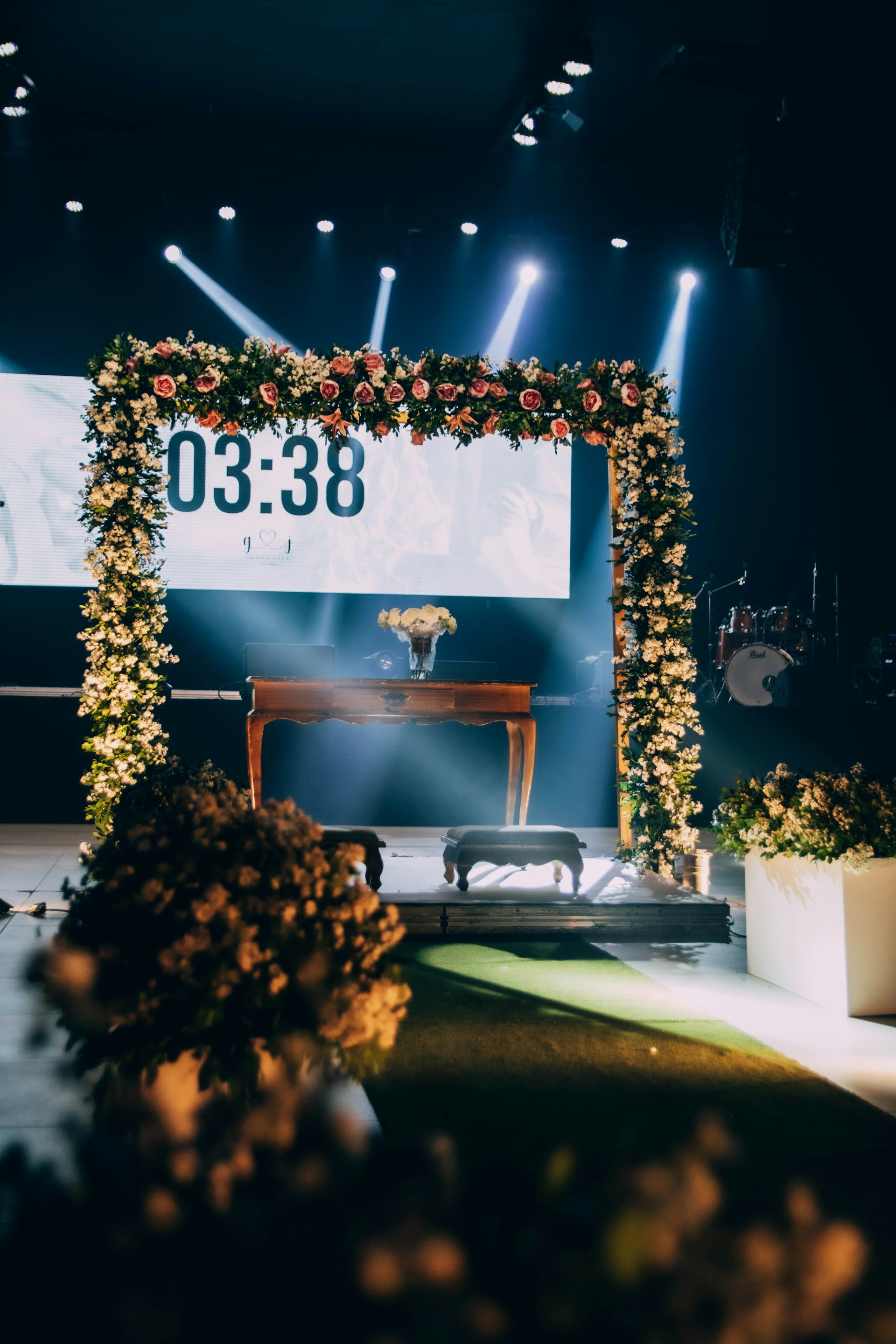 Wedding ceremony setup with floral decorations.