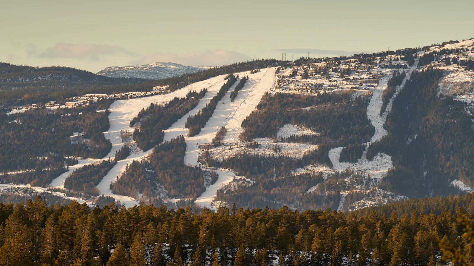 A Norway ski slope with cabins in winter