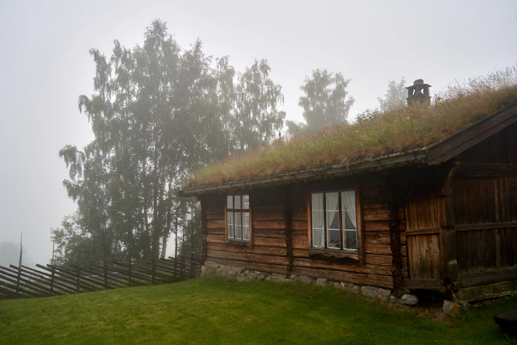 A handcrafted wooden cabin nestled in the Norwegian wilderness