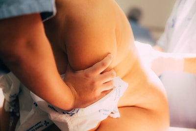 A medical professional assists a woman during labor.