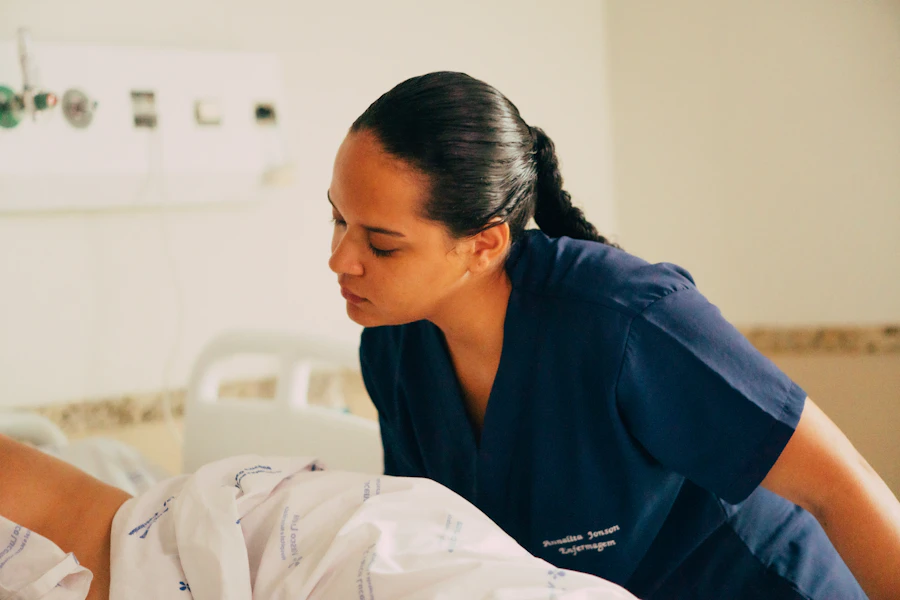 Nursing student smiling while organizing study materials before a class
