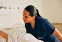A nurse is attending to a patient in a hospital.