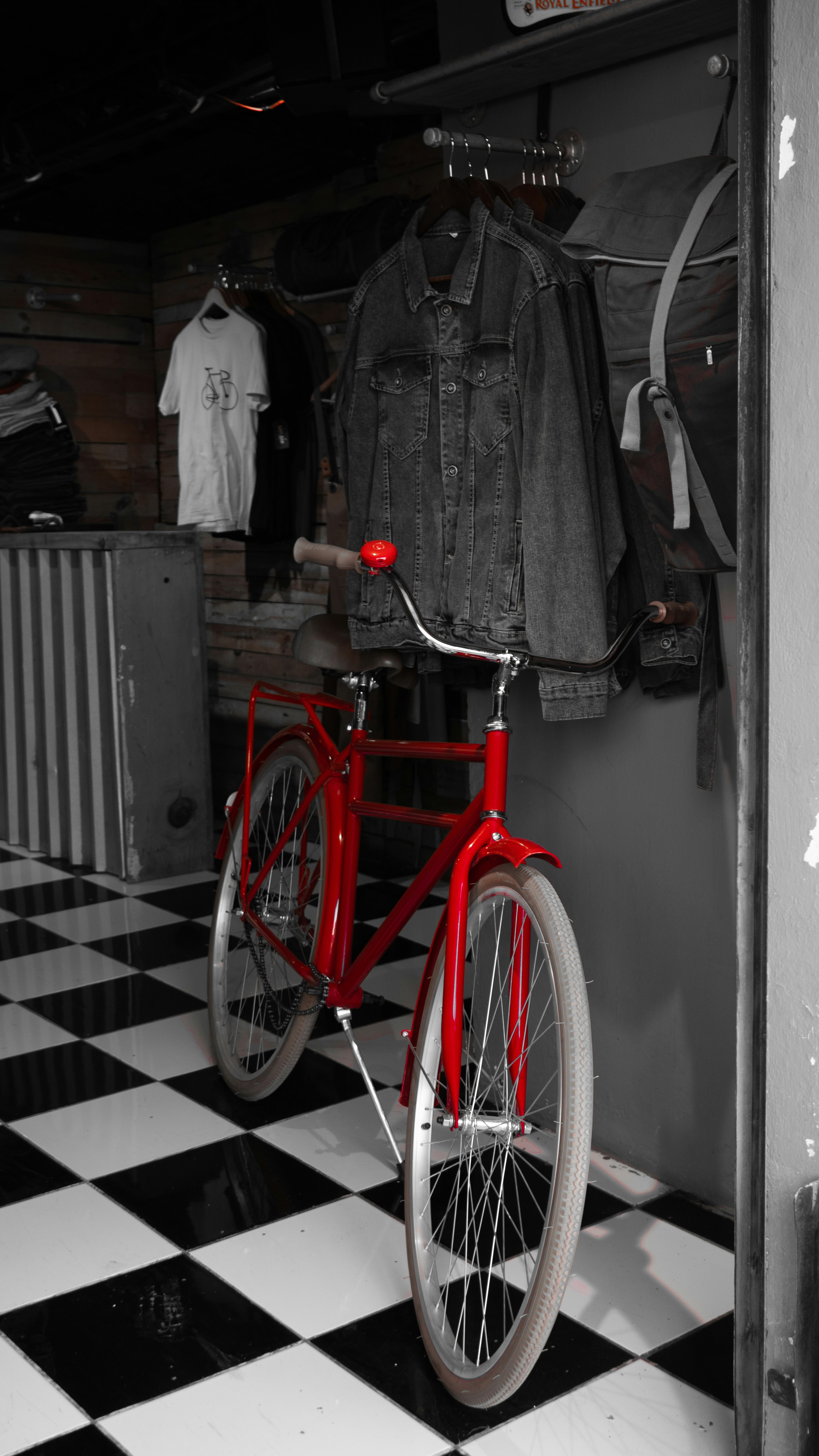 A red bicycle stands in a stylish room.
