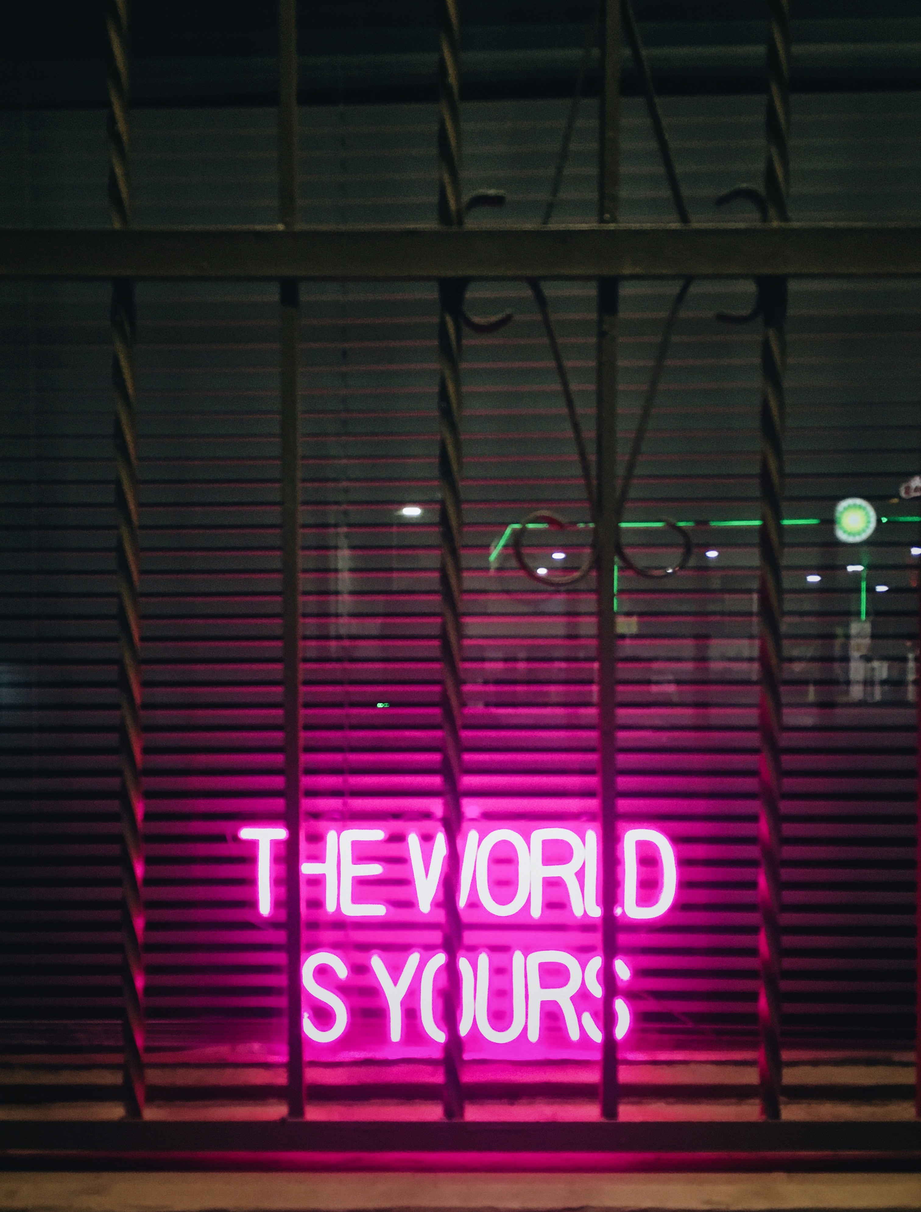 Pink neon sign says 