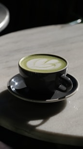 Matcha latte with artistic foam.