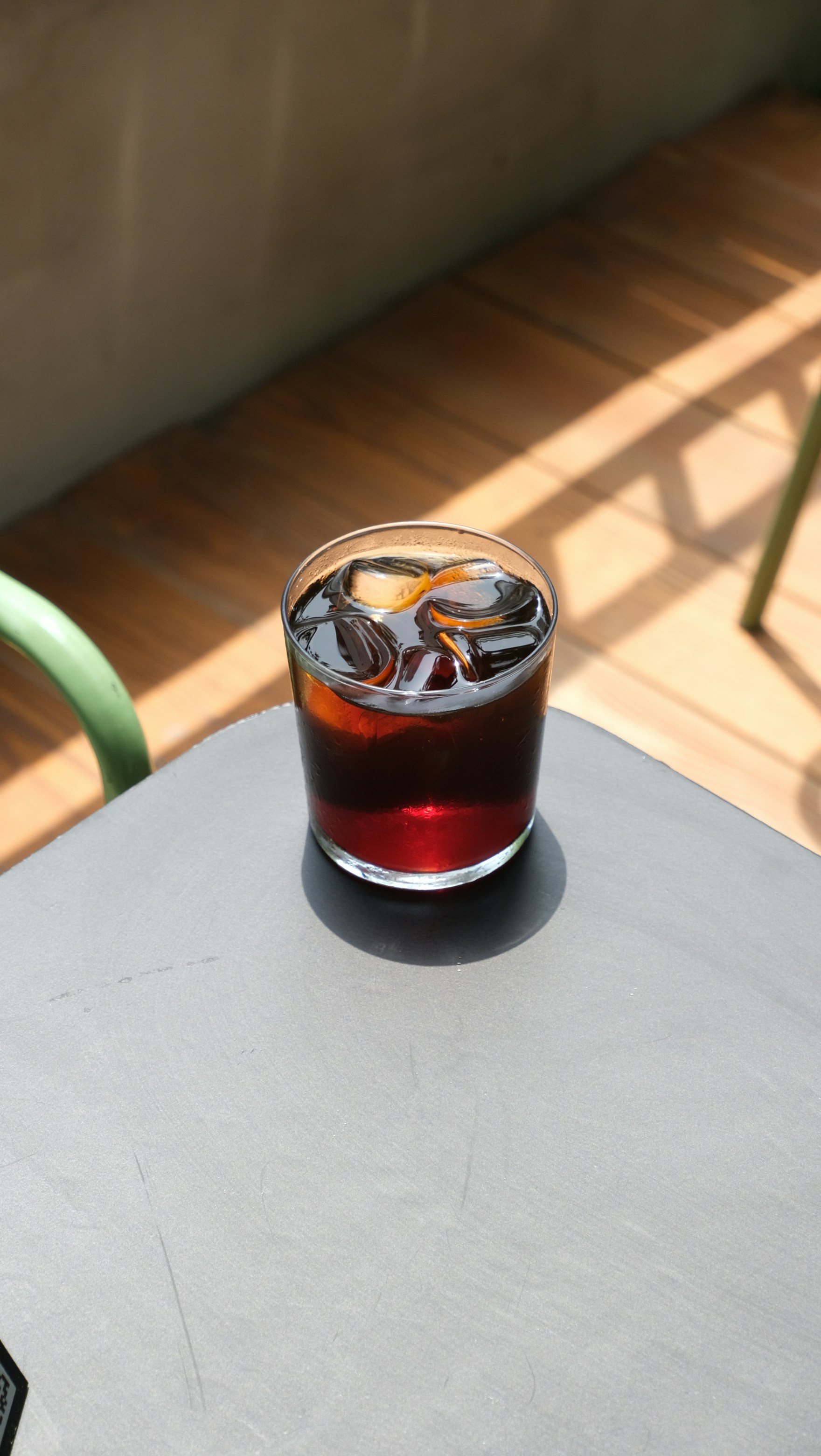 An iced coffee sits on a table.