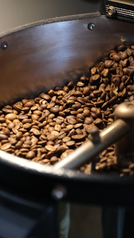Coffee beans roasting in a machine.