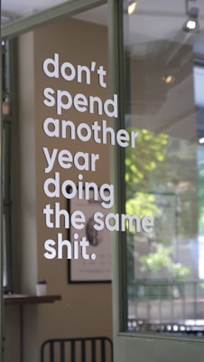 The sign encourages breaking routine and change.