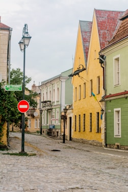 Cobblestone street with colorful buildings.