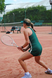 A tennis player prepares to return the ball.