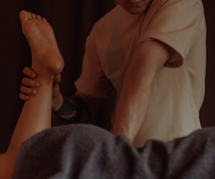 Someone receives a leg massage.