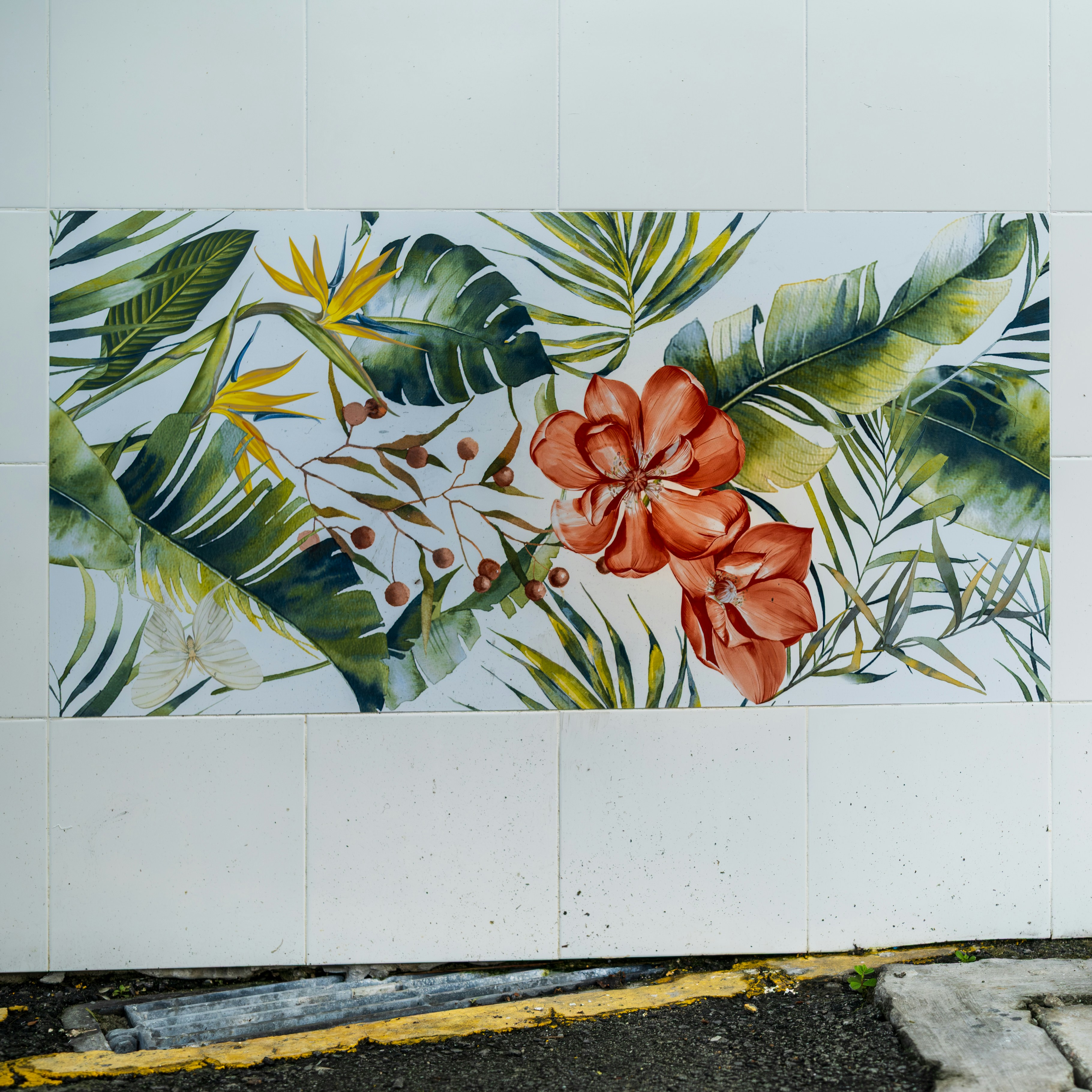Floral mural with vibrant leaves and flowers.