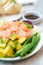 Shrimp salad with avocado and green beans.