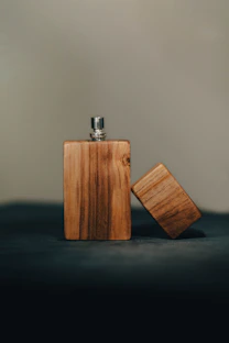 Wooden flask with its cap beside it.