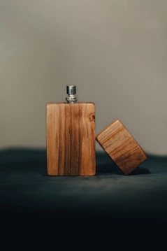 Wooden flask with its cap beside it.