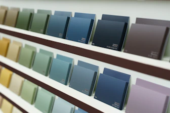 Paint color swatches are displayed on a shelf.