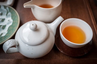 White teaware set with warm tea.
