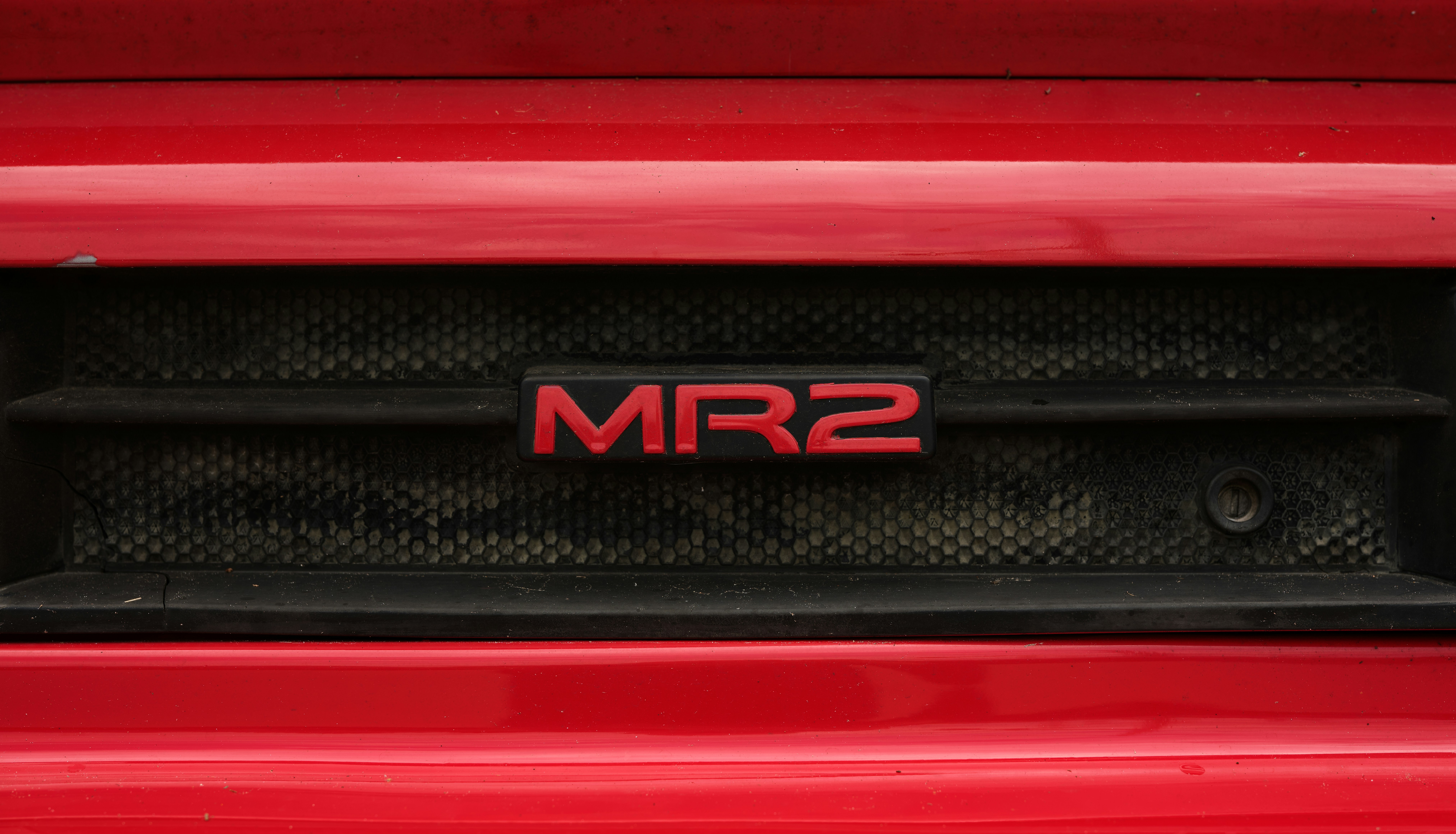 A red mr2 badge is visible on black grill.