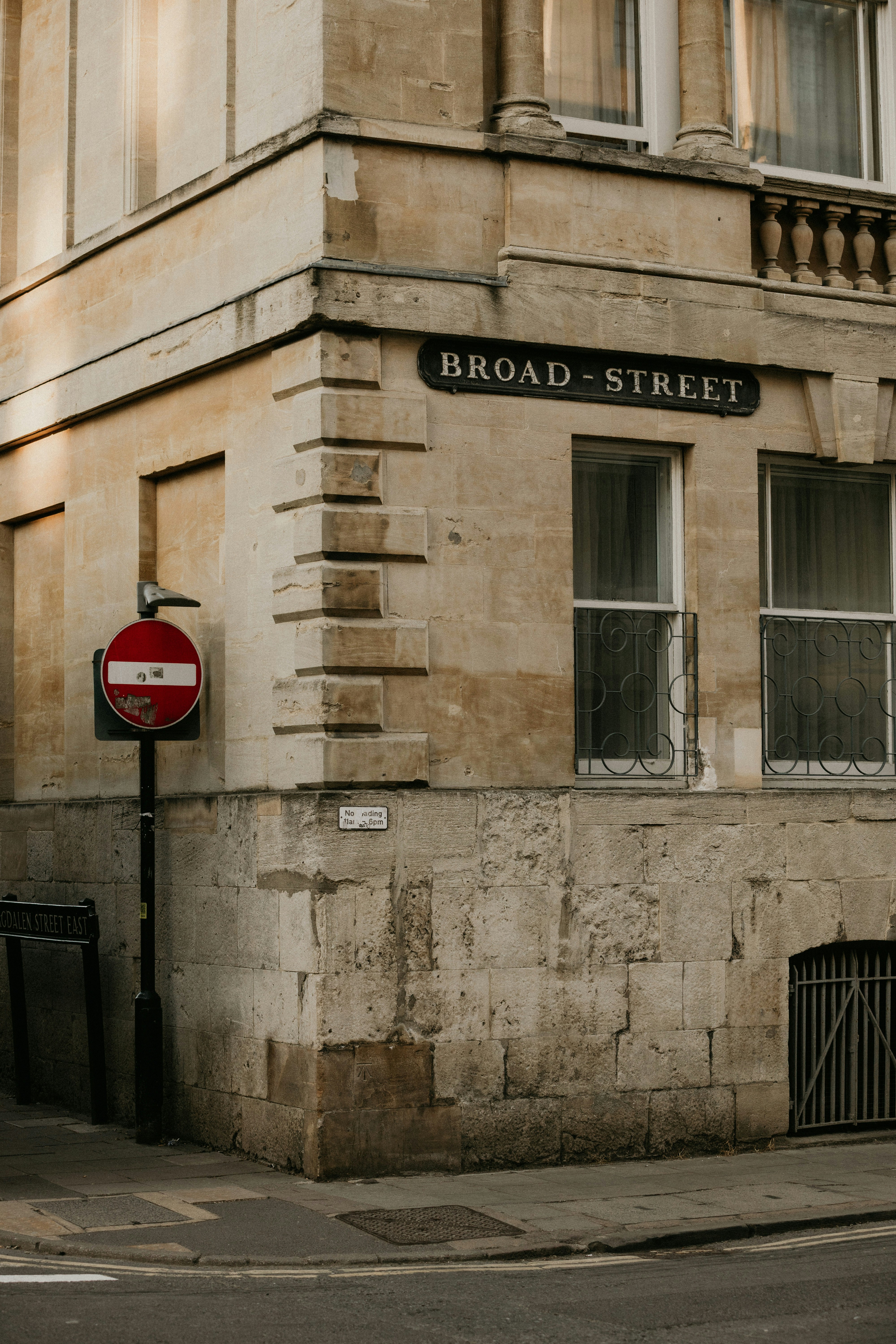 Corner of a stone building on broad street.
