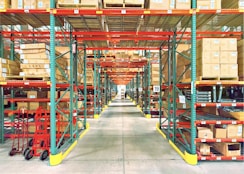 A warehouse is filled with shelves and boxes.