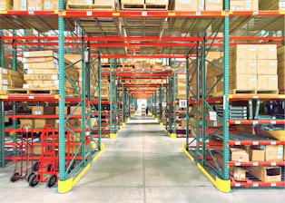 A warehouse is filled with shelves and boxes
