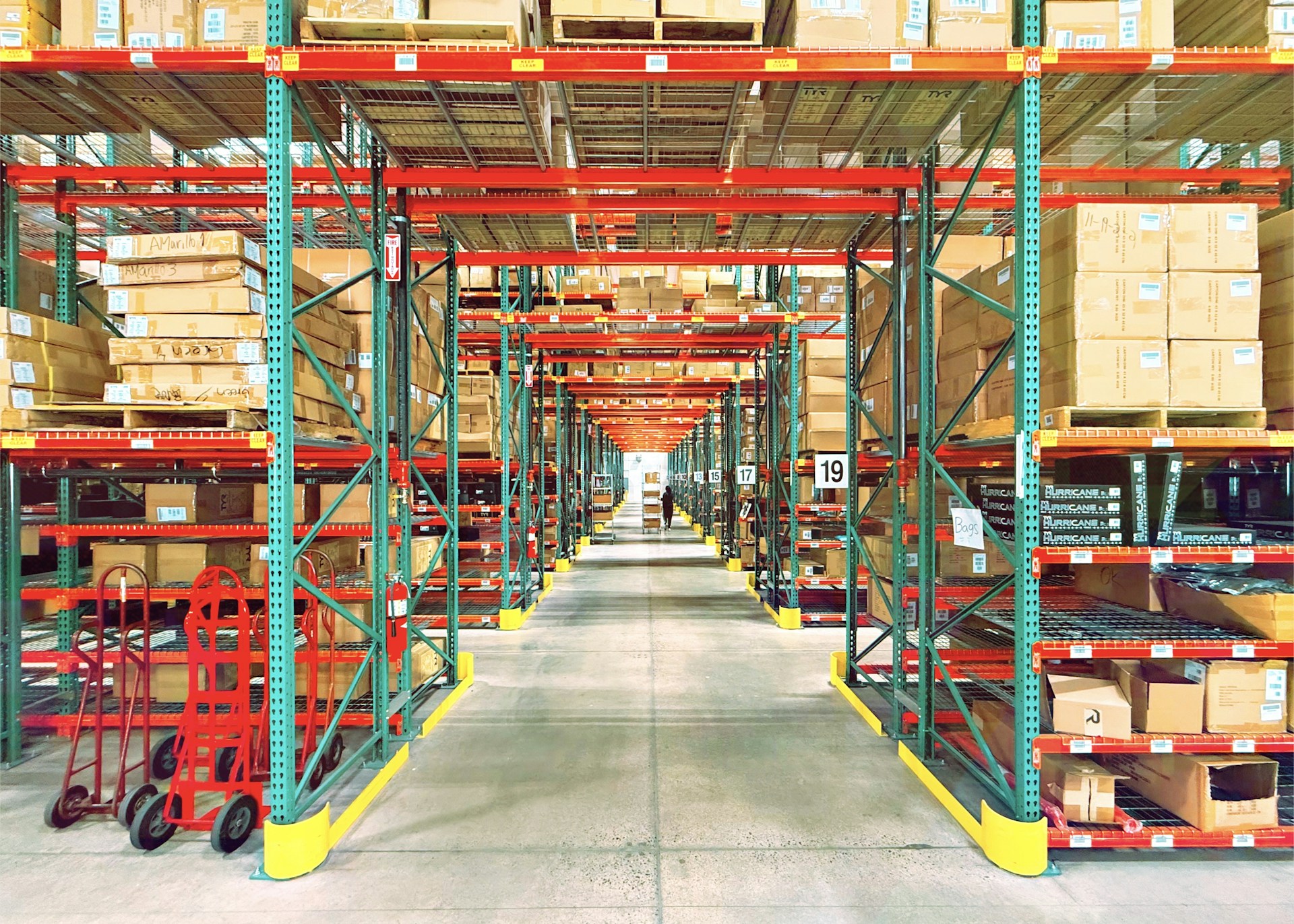 A warehouse is filled with shelves and boxes.