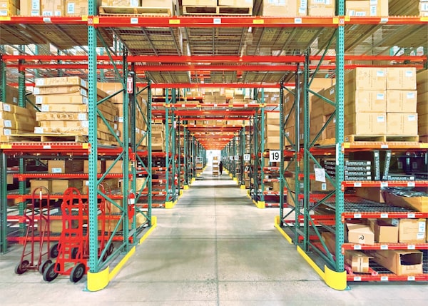 Large warehouse with shelving rows and boxes