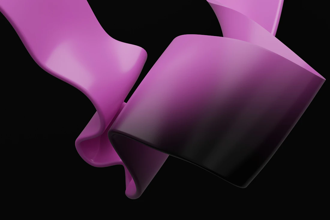 A pink ribbon against a black background