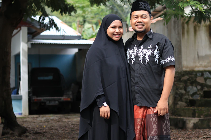A muslim couple poses for a photo together.