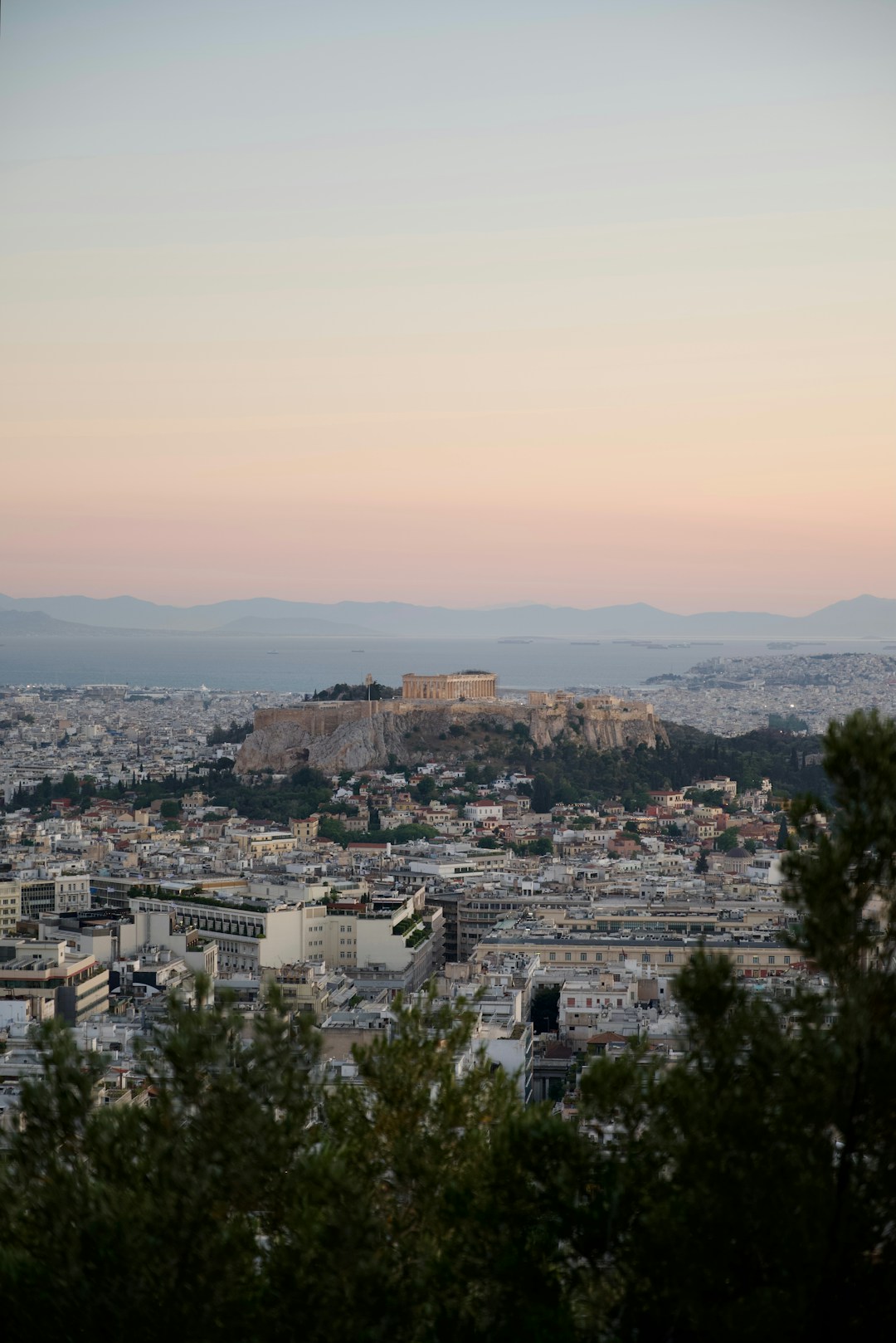 Acropolis and Athens skyline at golden hour in Athens