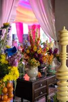 Bright floral arrangement adorns a decorative table.