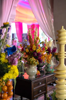 Bright floral arrangement adorns a decorative table.
